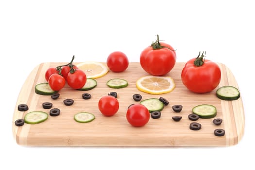 Composition of tomatoes and olives. Isolated on a white background.