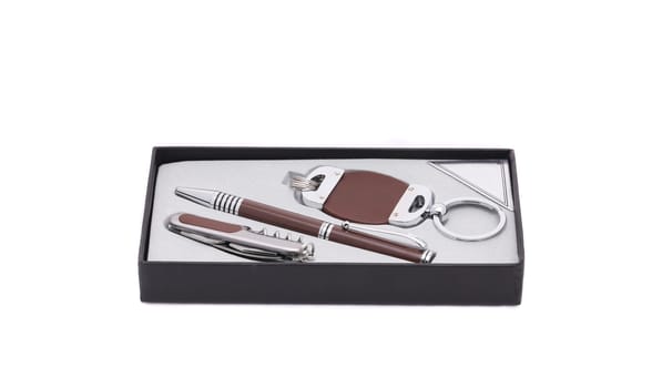 Pen and trinket in a box. Isolated on a white background.