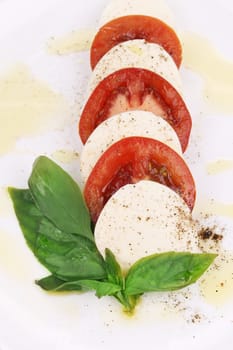 Caprese salad. Isolated on a white background.