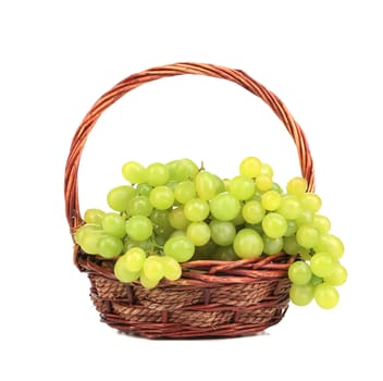Basket with white grapes. Isolated on a white background.