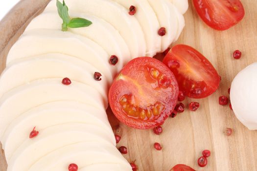 Tomatoes and mozzarella balls. Close up. Whole background.