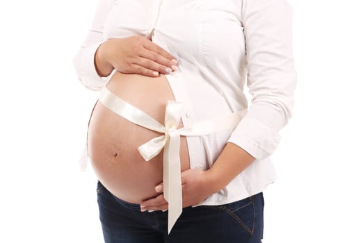 Belly of pregnant woman. Isolated on a white background.