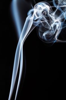 White smoke on black background. To be used as background.