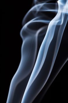 White smoke on black background. To be used as background.