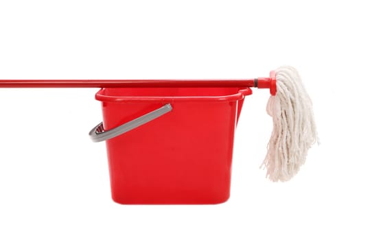 Red bucket with cleaning mop. Isolated on a white background.