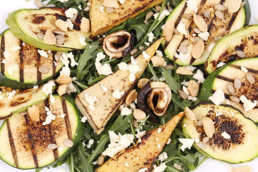 Salad with grilled vegetables and tofu. Whole background.