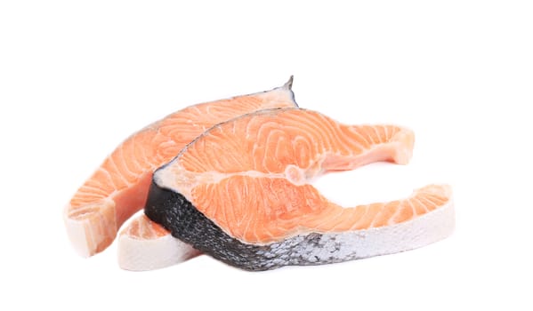 Two fresh salmon steaks. Isolated on a white background.