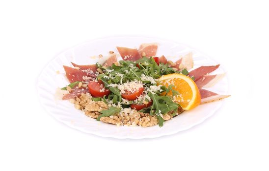 Salad with arugula and prosciutto. Isolated on a white background.