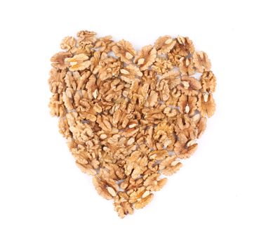 Walnuts in heart shape. Isolated on a white background.