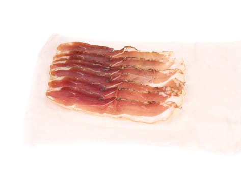 Slices of Delicious Prosciutto. Isolated on a white background.