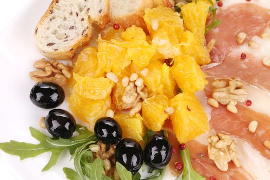 Salad with arugula and prosciutto. Macro. Whole background.