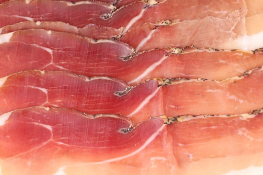 Slices of Delicious Prosciutto. Close up. Whole background.