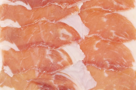 Slices of Delicious Prosciutto. Close up. Whole background.