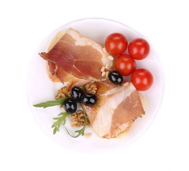 Salad with arugula and prosciutto. Isolated on a white background.