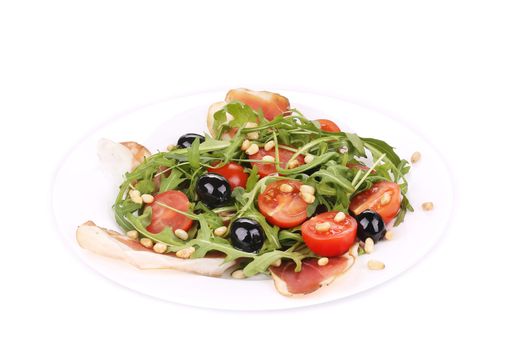 Salad with arugula and prosciutto. Isolated on a white background.