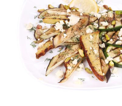 Salad with grilled vegetables and tofu. Isolated on a white background.