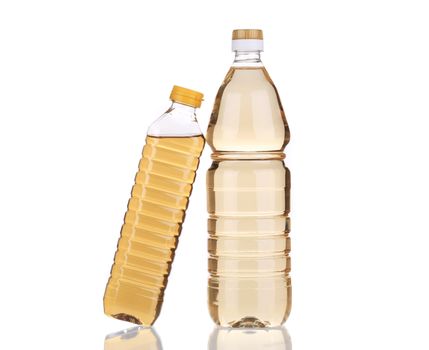 Two bottles of vinegar. Isolated on a white background.