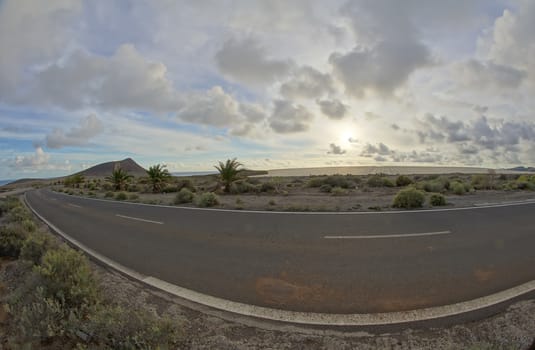 Long Empty Desert Road on a Cludy Day