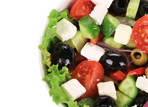 Fresh greek salad. Isolated on a white background.