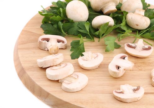 Mushrooms champignon on platter. Isolated on a white background.