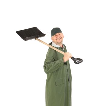 Man in green coat with snow shovel. Isolated on a white background.