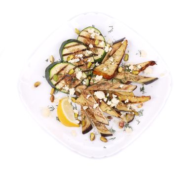 Salad with grilled vegetables and tofu. Isolated on a white background.