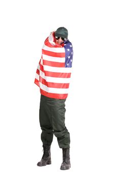 Man in workwear stands with american flag. Isolated on a white background.