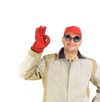Laughing welder showing okay sign. Isolated on a white background.