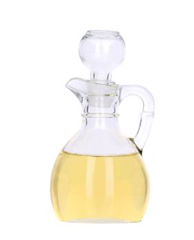 Sunflower oil in glass carafe. Isolated on a white background.