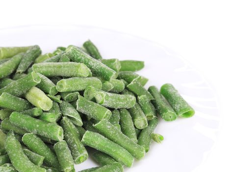 Frozen french beans. Isolated on a white background.