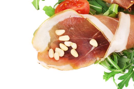 Salad with arugula and prosciutto. Isolated on a white background.