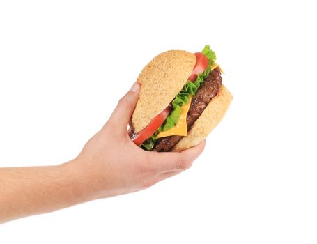 Male hand holding tasty hamburger. Isolated on a white background.