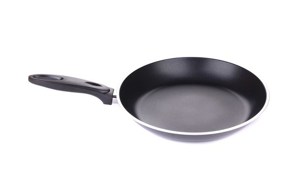 Black metal frying pan. Isolated on a white background.