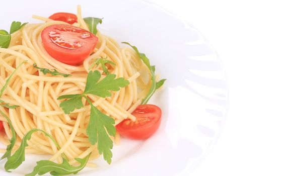 Delicious spaghetti with herbs. Isolated on a white background.