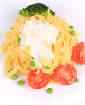 Tasty italian pasta with white sauce. Isolated on a white background.