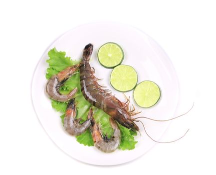 Fresh shrimps and lime. Isolated on a white background.