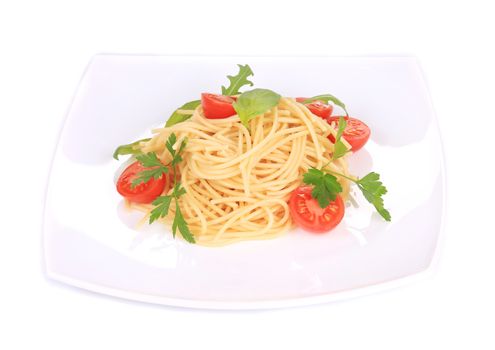 Delicious italian spaghetti with herbs and tomatoes. Isolated on a white background.