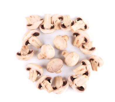 Fresh sliced champignon mushrooms. Isolated on a white background.