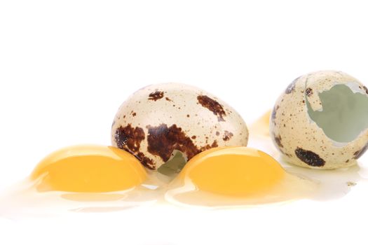 Broken quail eggs. Isolated on a white background.
