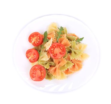 Italian pasta farfalle with arugula. Isolated on a white background.