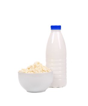 Bottle of milk and tasty cottage cheese. Isolated on a white background.