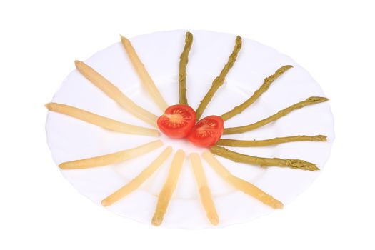 Asparagus and tomato-cherry. Isolated on a white background.