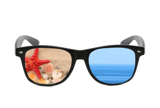 Sunglasses with beach and sea reflection. Isolated on a white background.