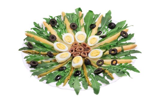 Asparagus salad with anchovies. Isolated on a white background.