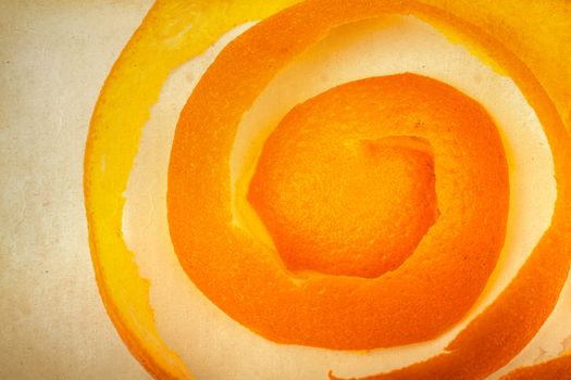 orange peel on the background of old paper