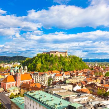 Panorama of the vibrant Slovenian capital Ljubljana in afternoon sun.