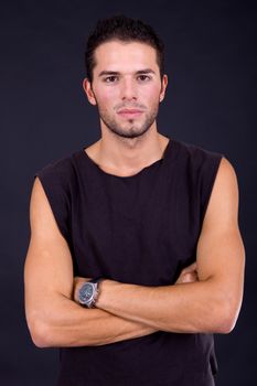 young casual man portrait on a black background