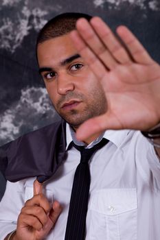 young business man, in front of a dark background