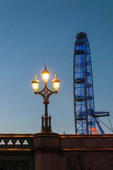 LONDON, UNITED KINGDOM - MAY 10: Lantern and London Eye in the background at dusk on May 10, 2011 in London.