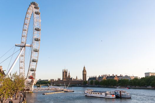 LONDON, UNITED KINGDOM - MAY 10: London Eye and Houses of Parliament on May 10, 2011 in London.